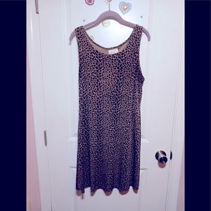 Brown/tan animal print slinky dress.Hugs curves gently, hides extra lbs.Size 10.